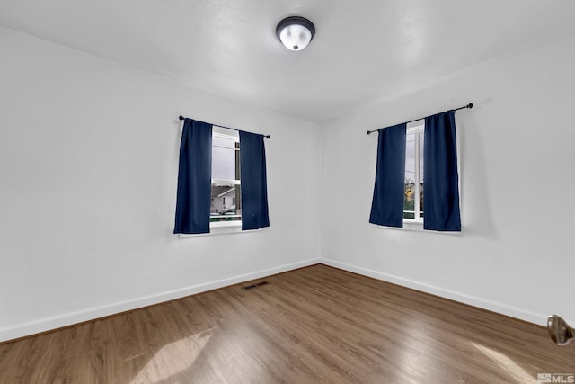 435 14th St, Sparks, NV 89431 - empty room featuring healthy amount of natural light, wood finished floors, and baseboards