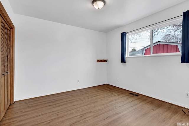 435 14th St, Sparks, NV 89431 - unfurnished bedroom with wood finished floors, a closet, and baseboards