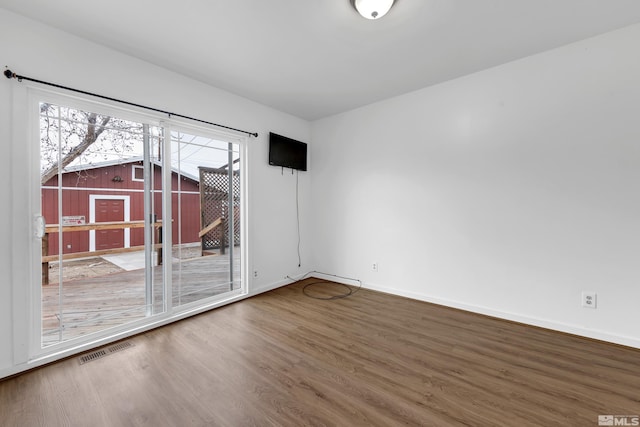 435 14th St, Sparks, NV 89431 - empty room with wood finished floors, healthy amount of natural light, and baseboards