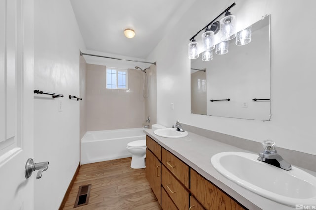 435 14th St, Sparks, NV 89431 - bathroom featuring  shower combination, wood finished floors, toilet, and double vanity