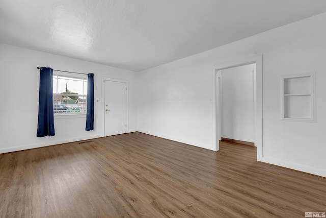435 14th St, Sparks, NV 89431 - spare room featuring wood finished floors, baseboards, and built in shelves