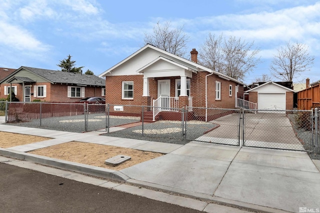 435 14th St, Sparks, NV 89431 - view of front facade with a gate, brick siding, concrete driveway, and a fenced front yard