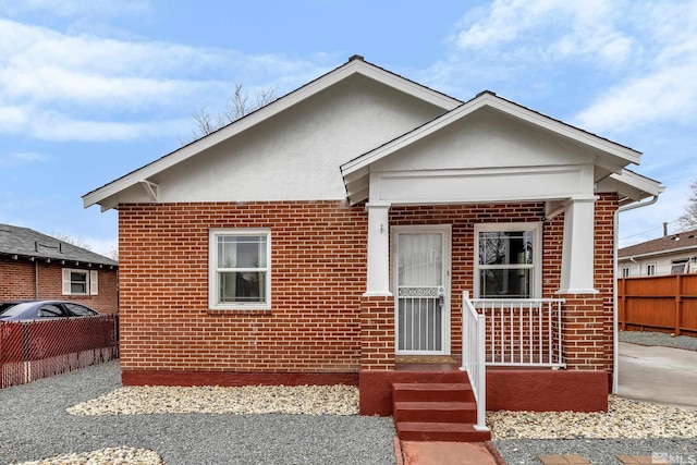 435 14th St, Sparks, NV 89431 - bungalow-style home featuring brick siding, fence, and stucco siding