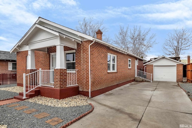 435 14th St, Sparks, NV 89431 - view of side of home featuring brick siding, an outbuilding, a chimney, driveway, and a detached garage