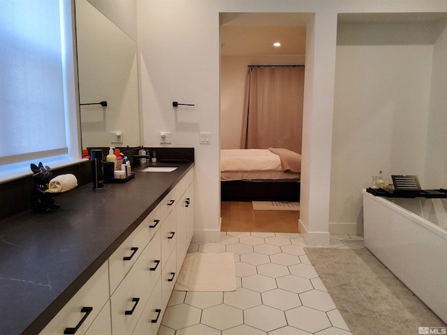 5449 Side Saddle Trl, Reno, NV 89511 - full bathroom featuring tile patterned floors, vanity, a soaking tub, and recessed lighting