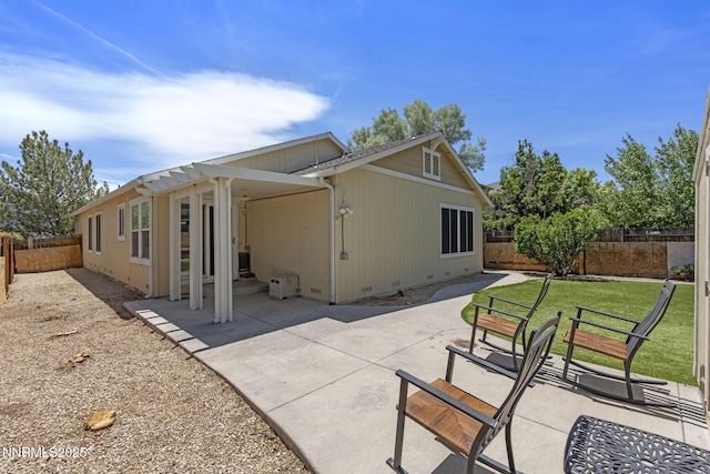 7721 Welsh Dr, Reno, NV 89506 - rear view of property with a fenced backyard, a patio area, and crawl space