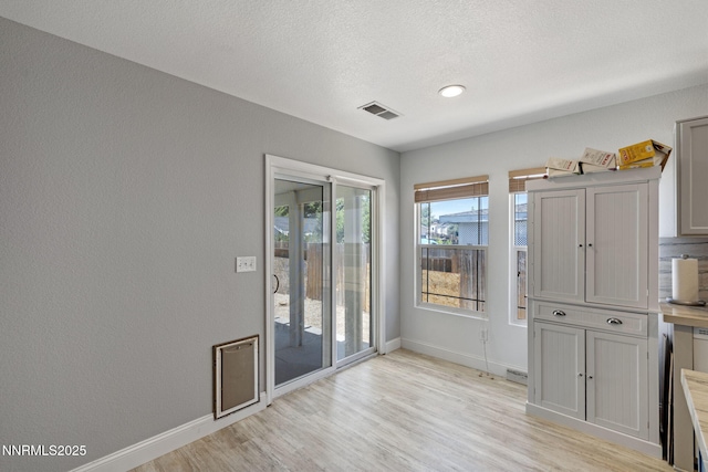 7721 Welsh Dr, Reno, NV 89506 - foyer entrance with light wood-style flooring and a textured ceiling