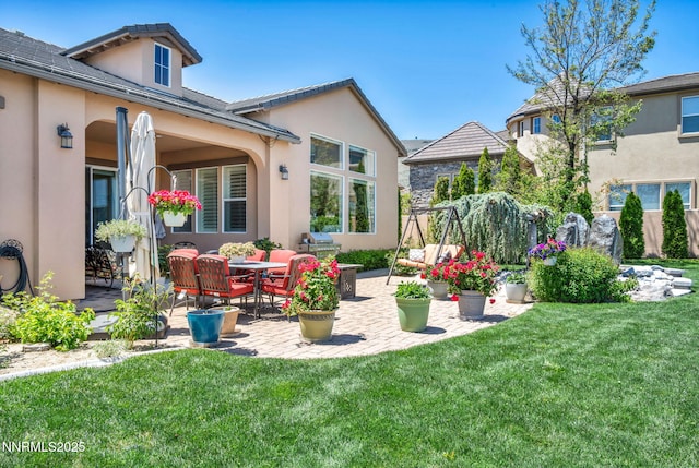 10100 Via Ponte, Reno, NV 89511 - view of grassy yard with a patio area