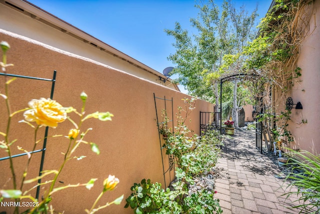 10100 Via Ponte, Reno, NV 89511 - view of side of home with stucco siding and a patio