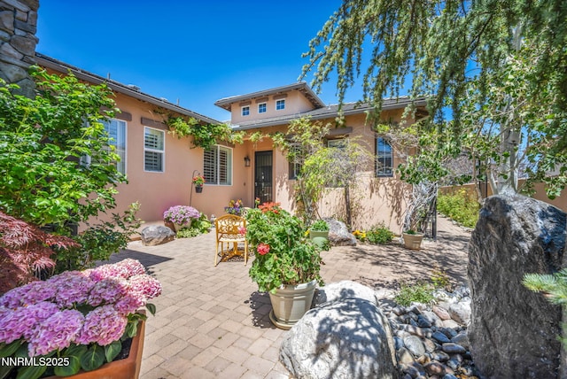 10100 Via Ponte, Reno, NV 89511 - view of front of house featuring stucco siding and a patio