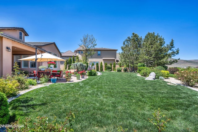 10100 Via Ponte, Reno, NV 89511 - view of green lawn featuring a patio
