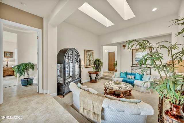 10100 Via Ponte, Reno, NV 89511 - living room with a skylight, baseboards, recessed lighting, and lofted ceiling