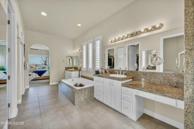 10100 Via Ponte, Reno, NV 89511 - full bath featuring connected bathroom, a bath, vanity, tile patterned flooring, and recessed lighting