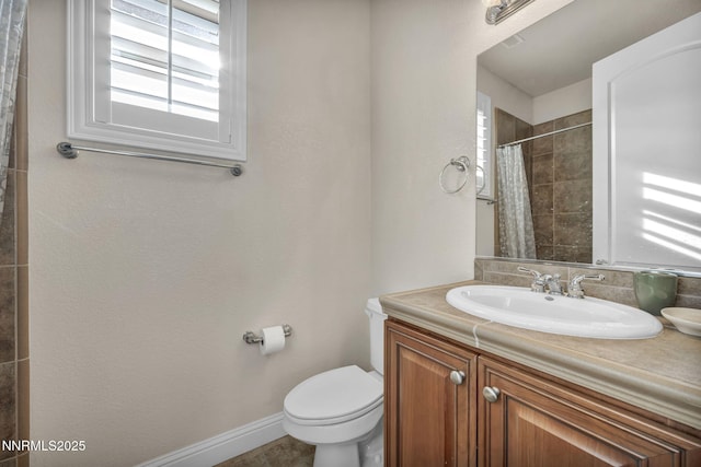 10100 Via Ponte, Reno, NV 89511 - bathroom featuring vanity, toilet, baseboards, and curtained shower