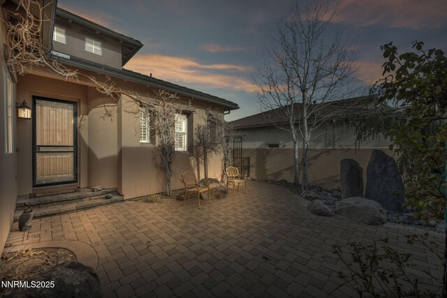10100 Via Ponte, Reno, NV 89511 - patio terrace at dusk featuring a patio area
