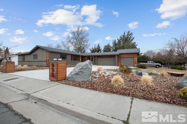 995 Skyline Blvd, Reno, NV 89509 - view of front of house with a garage and concrete driveway