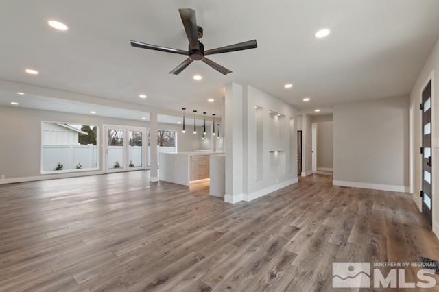 995 Skyline Blvd, Reno, NV 89509 - unfurnished living room with recessed lighting, baseboards, a ceiling fan, and wood finished floors