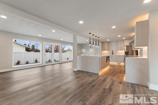 995 Skyline Blvd, Reno, NV 89509 - kitchen featuring baseboards, light wood-style flooring, recessed lighting, hanging light fixtures, and a center island