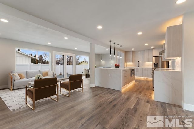 995 Skyline Blvd, Reno, NV 89509 - living area featuring light wood-style floors, baseboards, and recessed lighting