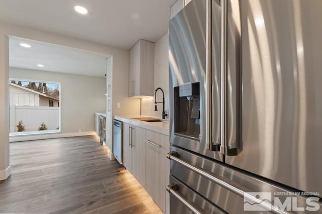 995 Skyline Blvd, Reno, NV 89509 - kitchen featuring stainless steel appliances, a sink, wood finished floors, light countertops, and recessed lighting