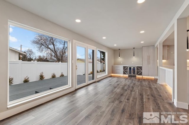 995 Skyline Blvd, Reno, NV 89509 - unfurnished living room with plenty of natural light, wood finished floors, recessed lighting, and beverage cooler