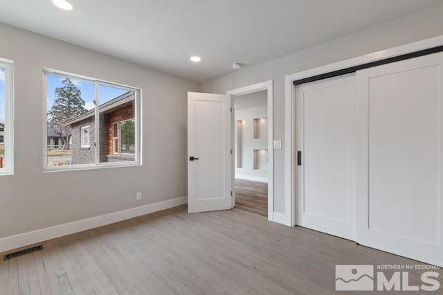 995 Skyline Blvd, Reno, NV 89509 - unfurnished bedroom featuring wood finished floors, baseboards, recessed lighting, and a closet