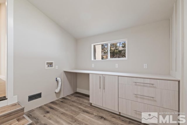 995 Skyline Blvd, Reno, NV 89509 - laundry room with washer hookup, cabinet space, and light wood-style flooring