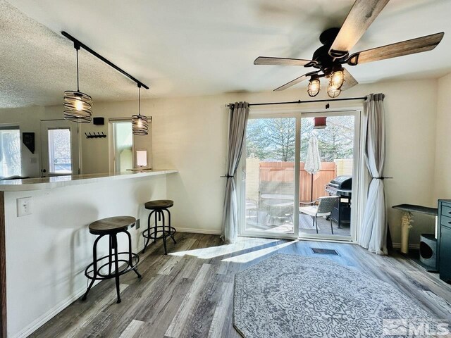3940 Pheasant, Carson City, NV 89701 - dining room featuring a ceiling fan, baseboards, and wood finished floors