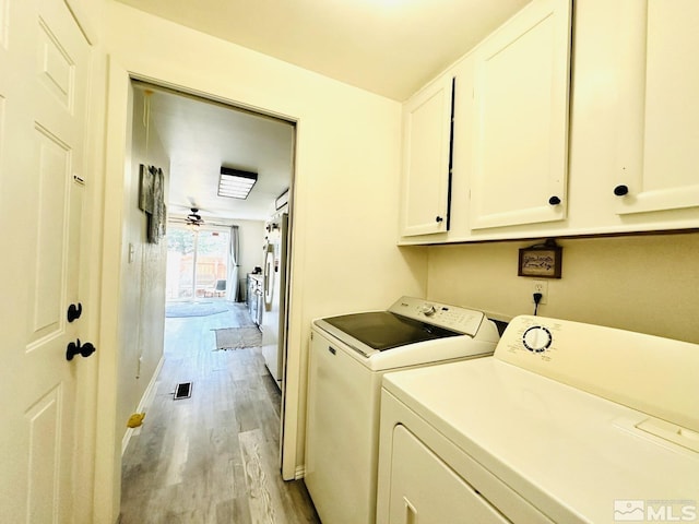 3940 Pheasant, Carson City, NV 89701 - laundry area featuring cabinet space, washing machine and dryer, light wood finished floors, ceiling fan, and baseboards