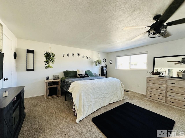 3940 Pheasant, Carson City, NV 89701 - bedroom featuring light carpet, a ceiling fan, a textured ceiling, and baseboards