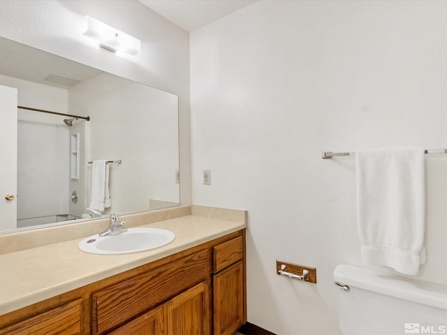 1465 E Peckham Ln Apt 55, Reno, NV 89502 - bathroom featuring toilet and vanity