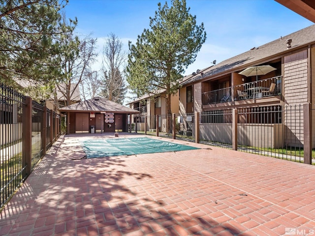 1465 E Peckham Ln Apt 55, Reno, NV 89502 - community pool with fence and a patio area