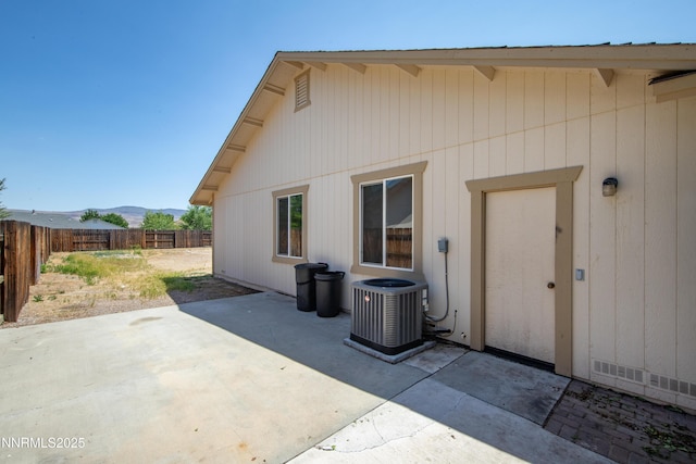 2172 Redhead Dr, Sparks, NV 89441 - back of house featuring central AC, a fenced backyard, a patio area, and a mountain view