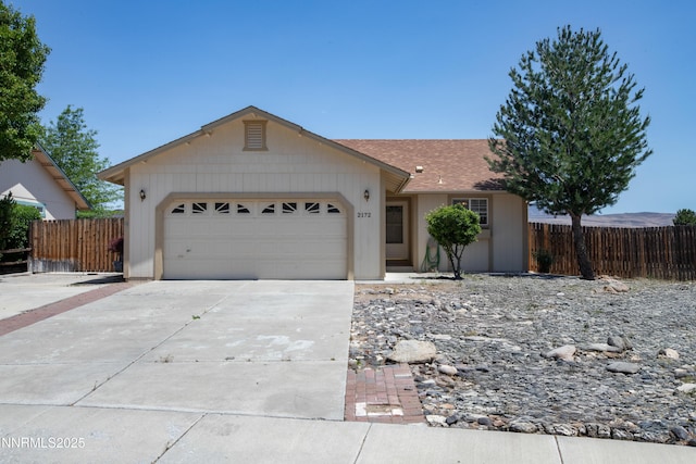 2172 Redhead Dr, Sparks, NV 89441 - single story home featuring a garage, driveway, and roof with shingles