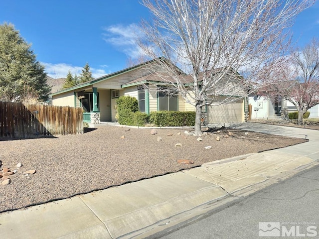 649 Rock Island Dr, Dayton, NV 89403 - view of front facade featuring driveway, fence, and a garage