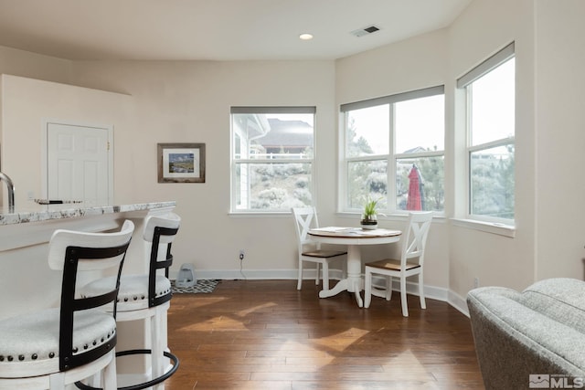 1659 Chiquita Ci, Minden, NV 89423 - dining space featuring dark wood finished floors, healthy amount of natural light, baseboards, and recessed lighting