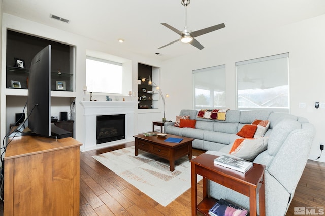 1659 Chiquita Ci, Minden, NV 89423 - living area featuring hardwood / wood-style floors, a ceiling fan, and a glass covered fireplace