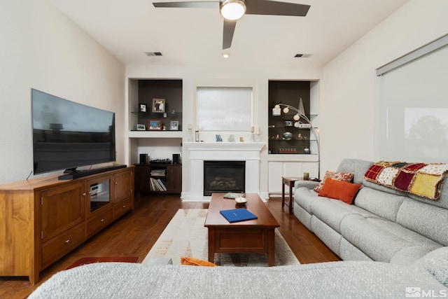 1659 Chiquita Ci, Minden, NV 89423 - living room with dark wood-type flooring, ceiling fan, and a glass covered fireplace