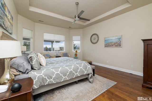 1659 Chiquita Ci, Minden, NV 89423 - bedroom featuring a tray ceiling, baseboards, wood finished floors, and ceiling fan