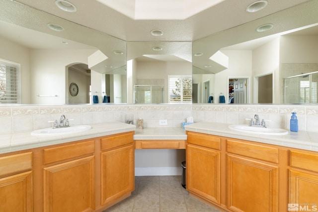 1659 Chiquita Ci, Minden, NV 89423 - bathroom with a stall shower, backsplash, tile patterned flooring, vanity, and recessed lighting