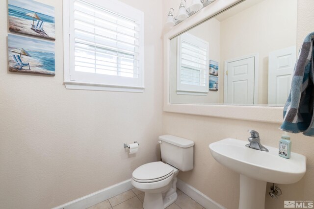 1659 Chiquita Ci, Minden, NV 89423 - half bathroom featuring tile patterned floors, toilet, baseboards, and a sink