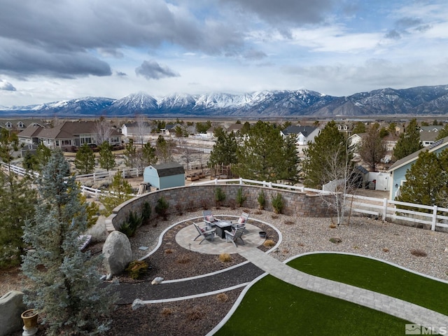 1659 Chiquita Ci, Minden, NV 89423 - surrounding community featuring fence, a mountain view, an outbuilding, and an outdoor fire pit