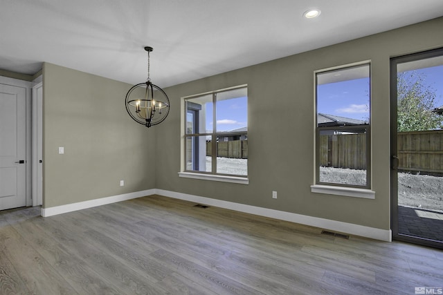 1791 La Cita, Minden, NV 89423 - unfurnished room featuring a chandelier, baseboards, wood finished floors, and recessed lighting