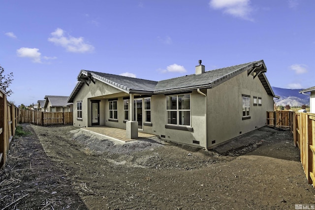 1791 La Cita, Minden, NV 89423 - rear view of house with stucco siding, a chimney, and a fenced backyard