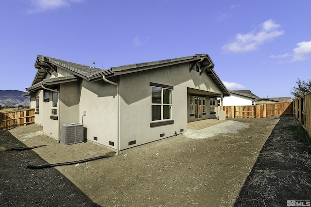 1791 La Cita, Minden, NV 89423 - rear view of property featuring crawl space, a fenced backyard, central air condition unit, and stucco siding