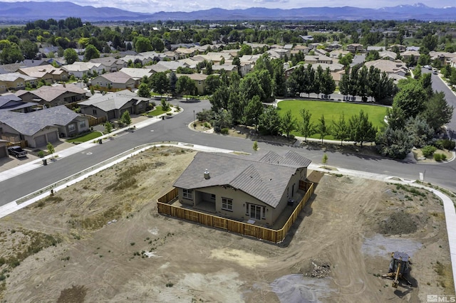 1791 La Cita, Minden, NV 89423 - aerial view of property and surrounding area featuring a mountain backdrop, nearby suburban area, and property parcel outlined