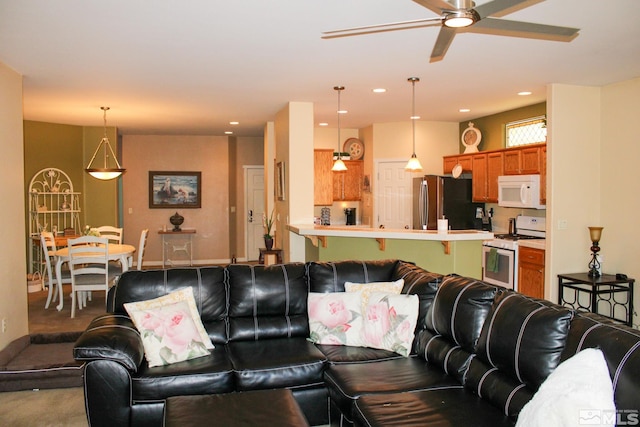 1090 Aster Ln, Fernley, NV 89408 - living room with ceiling fan, recessed lighting, and carpet