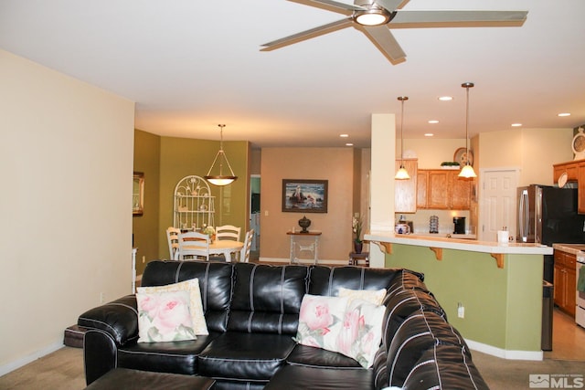 1090 Aster Ln, Fernley, NV 89408 - living room with ceiling fan, light colored carpet, baseboards, and recessed lighting