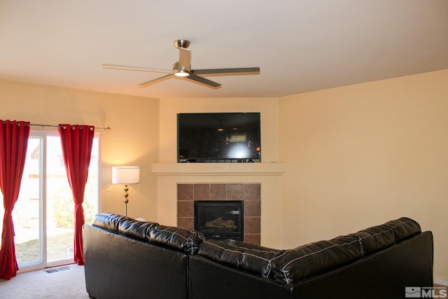 1090 Aster Ln, Fernley, NV 89408 - carpeted living area featuring ceiling fan and a fireplace