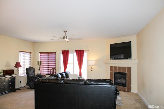 1090 Aster Ln, Fernley, NV 89408 - living area featuring light carpet, a ceiling fan, and a tiled fireplace